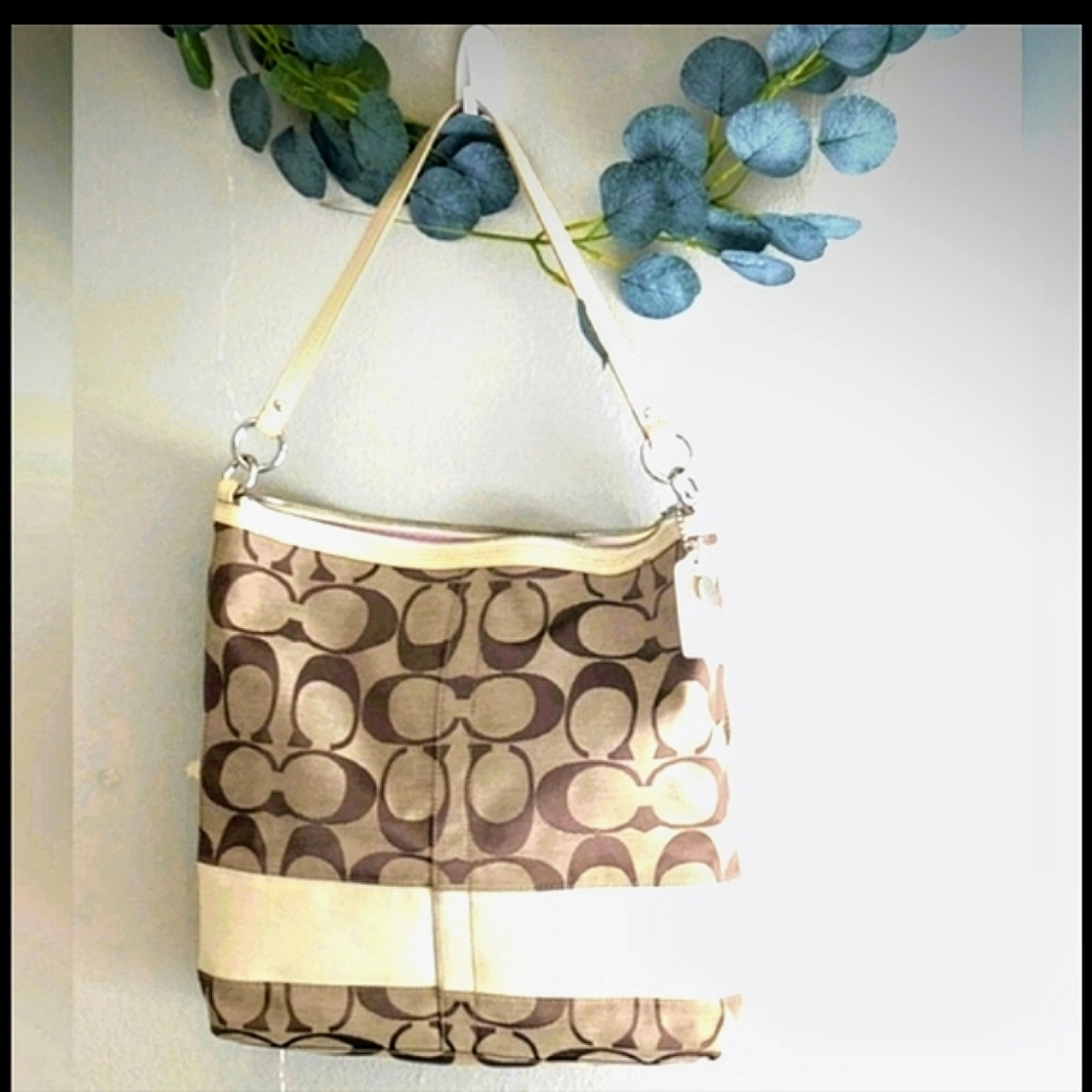 Coach- signature stripe ivory canvas and leather handbag. Good used condition.